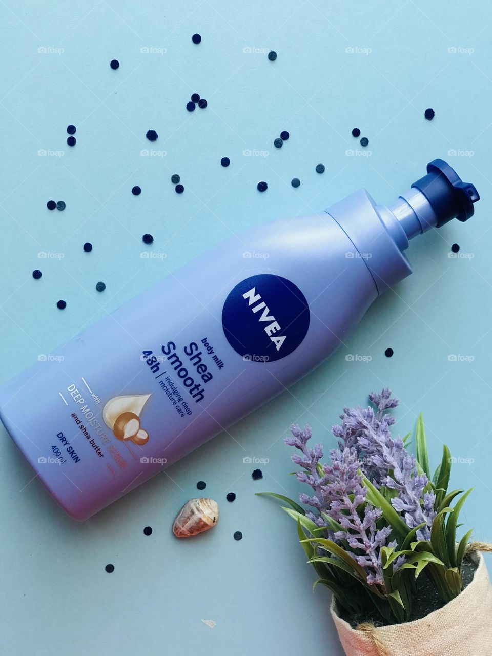 Nivea body lotion and lavender flowers and shell 