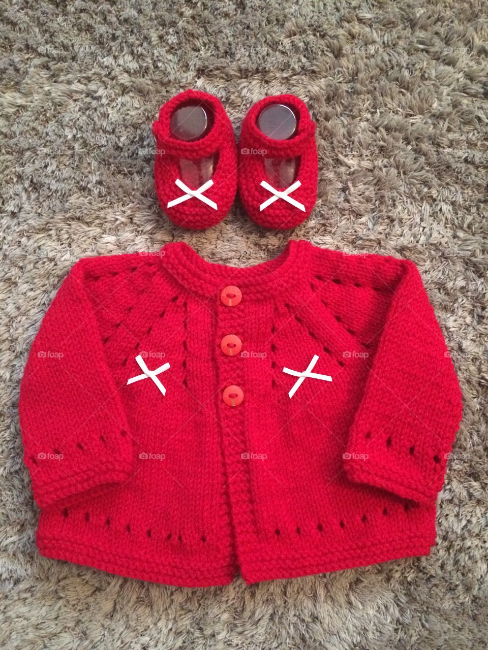 Hand knitted baby cardigan and Mary Jane style shoes