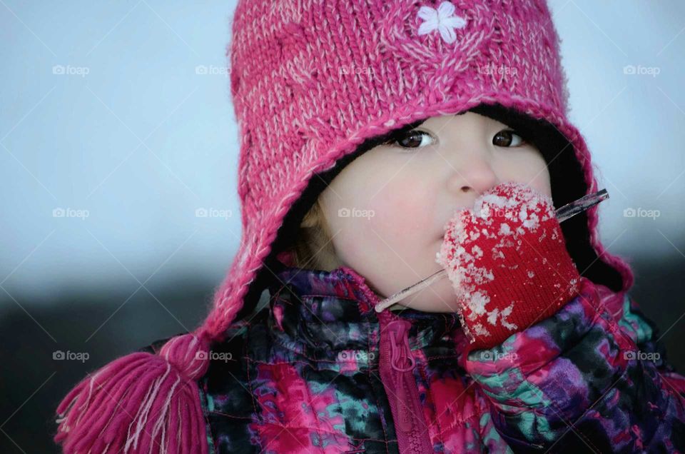 Girl woman eating icicle