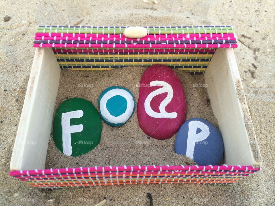 Foap on stones in a box of sand