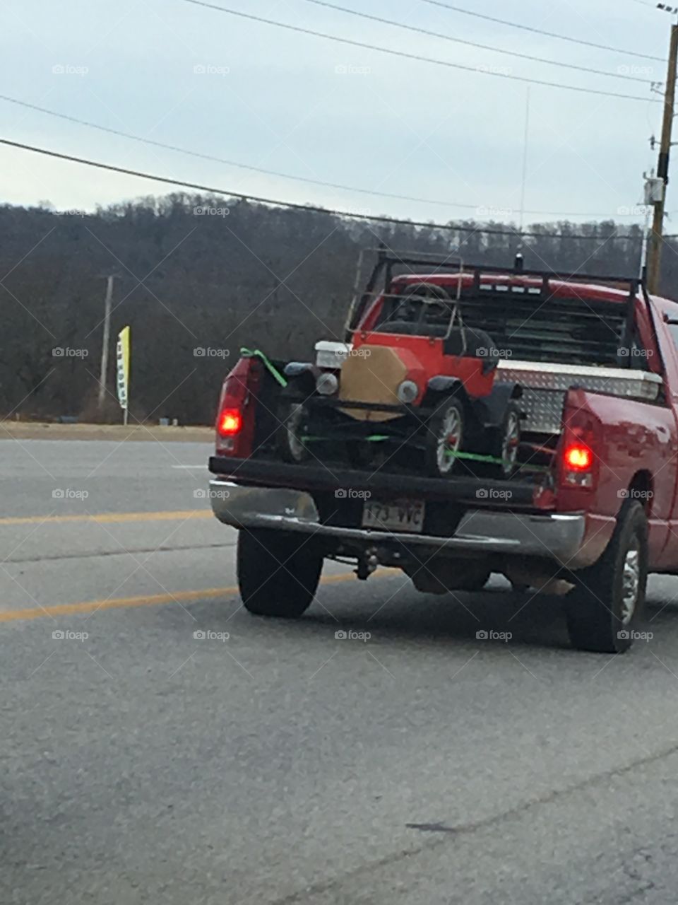 Going down the road and seen this cool car in the back of a pickup! To cool! 