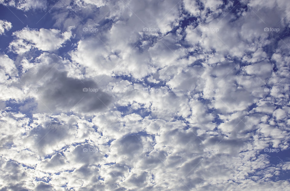 The beauty of the sky with clouds and the sun.