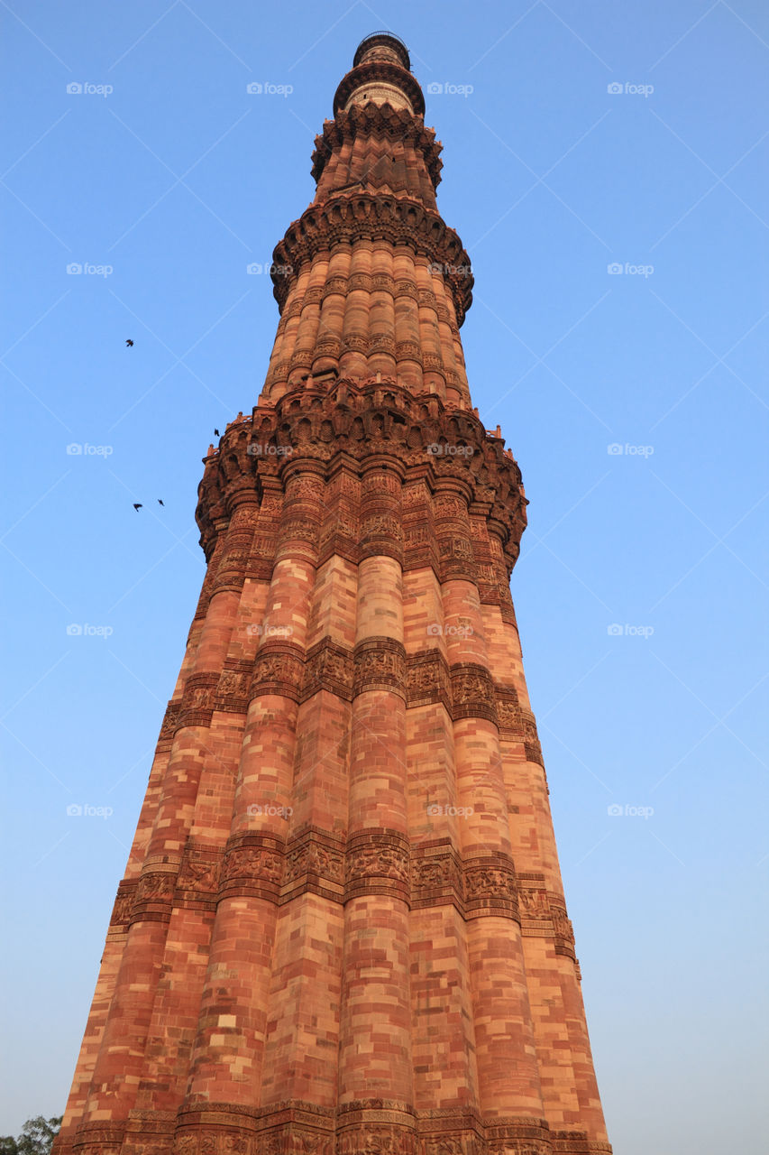 Qutub Minar in new Delhi, India. Old ancient architecture construction. Unesco world Heritage site.