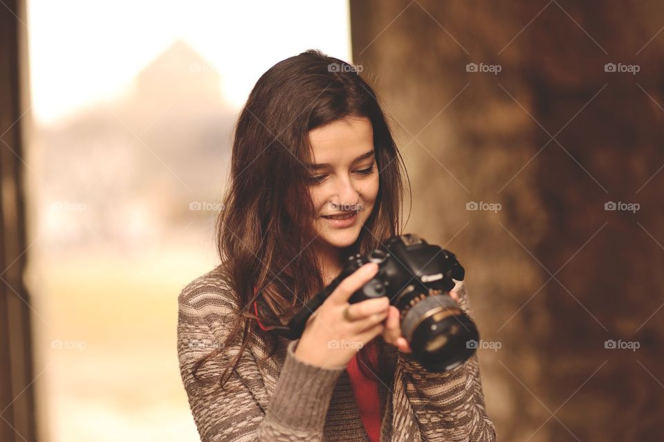 Woman taking picture on camera