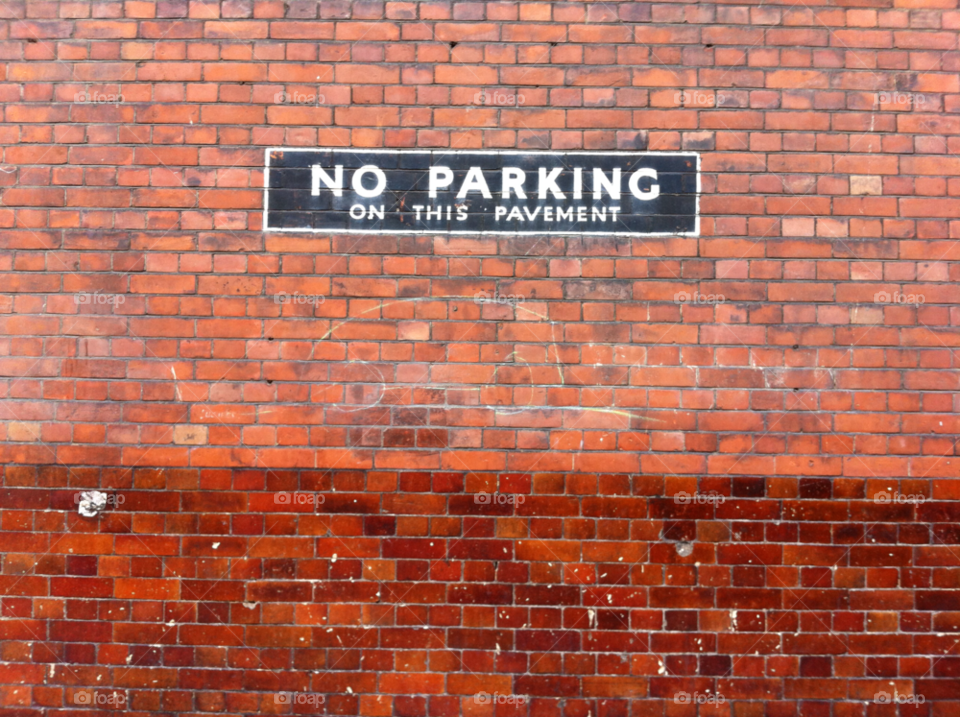 wall sign no parking brick by jhyturley