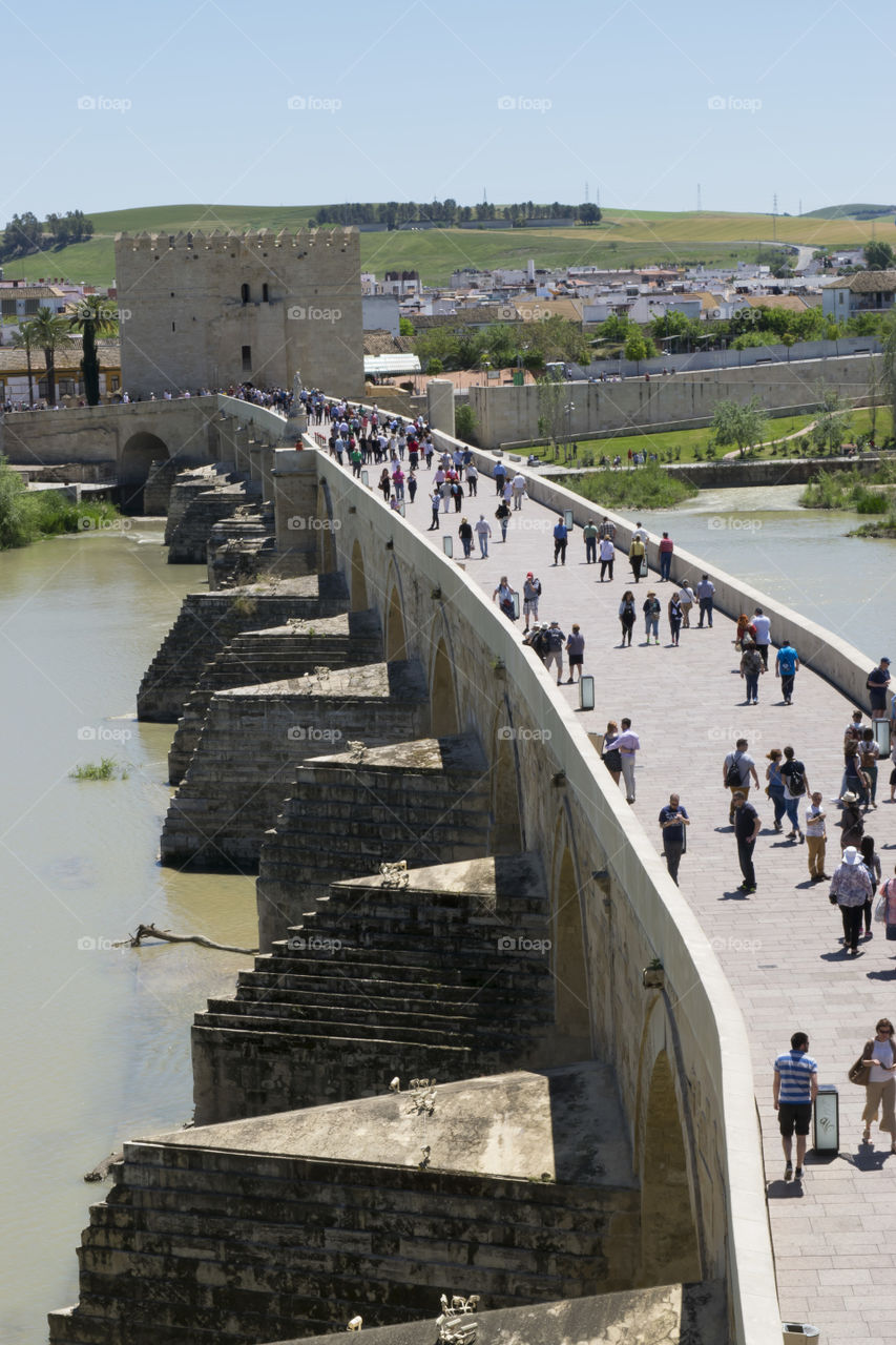 An ancient roman bridge over Guadalquivir river. Calahorra tower guards one side of the bridge.