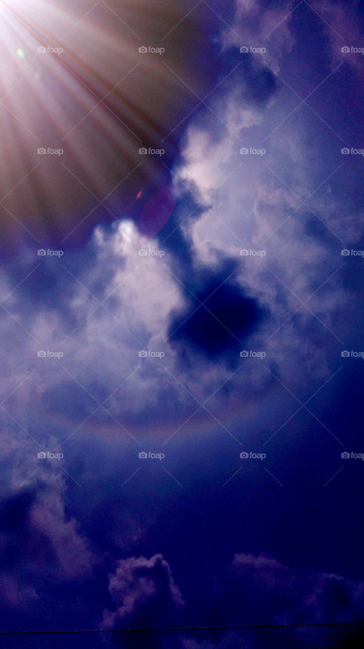 ring around the sun. this is a picture of the rainbow around the sun