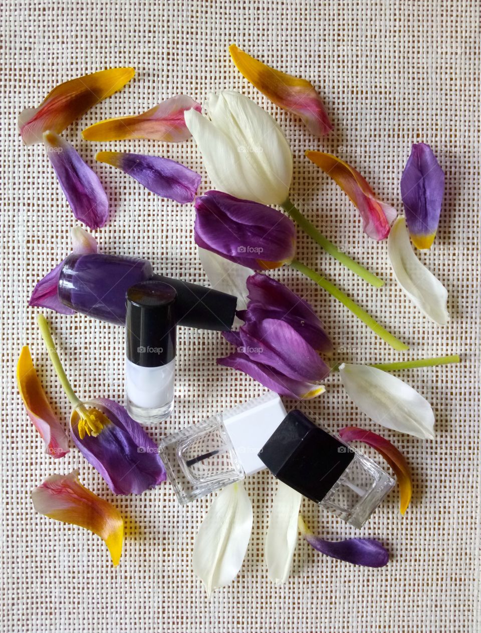 nail lacquers and tulips petals