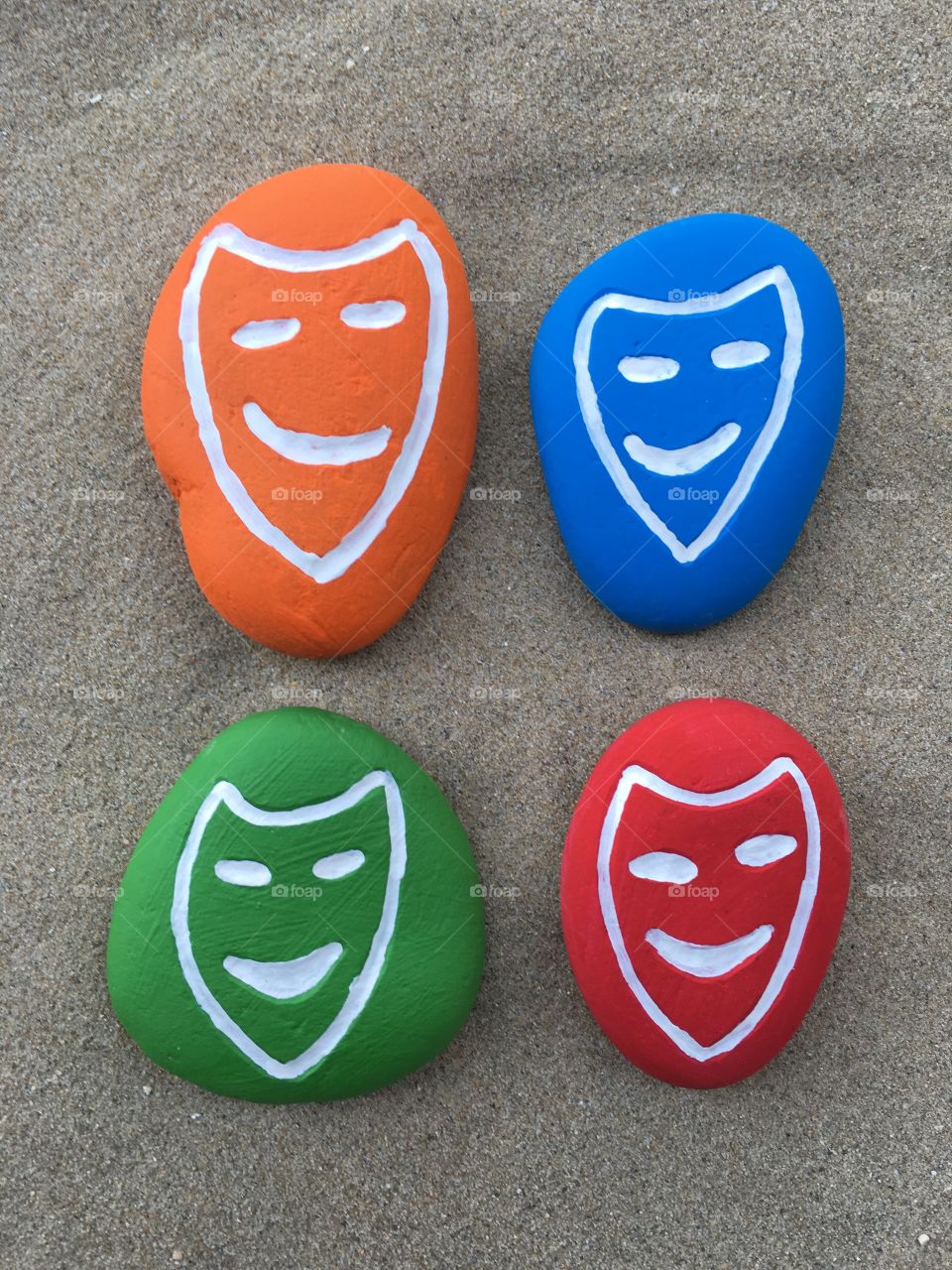 Carnival masks design on colored stones 
