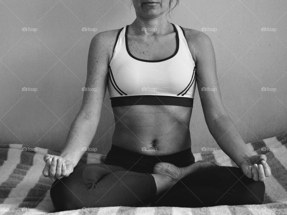 woman training yoga meditation in the room black and white background