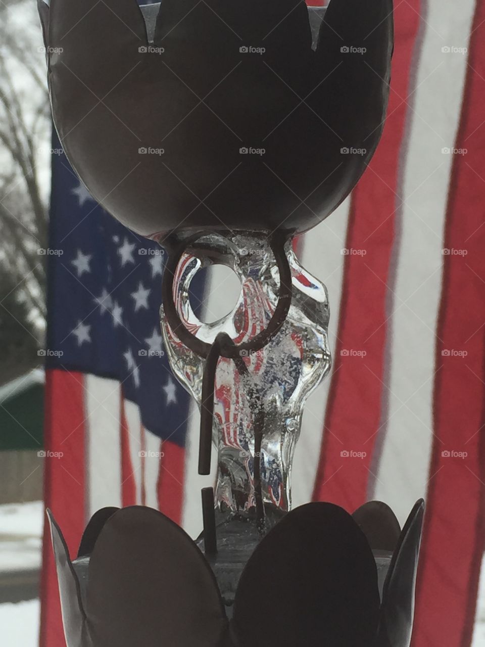 Ice formation on the rain chain with the flag