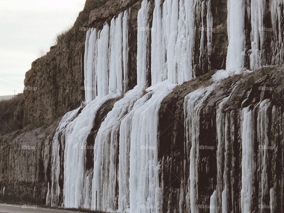 Icicles on side of rocks