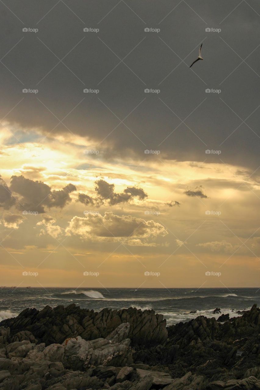 Horizontal photograph of a sunset at the ocean
