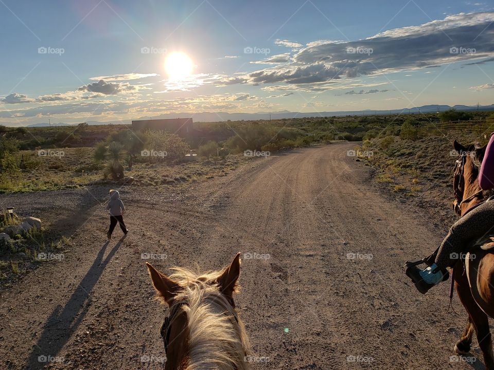 boys running with the horses