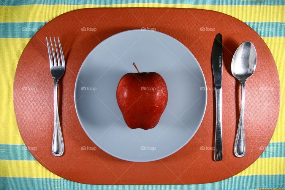 Apple in a plate setting