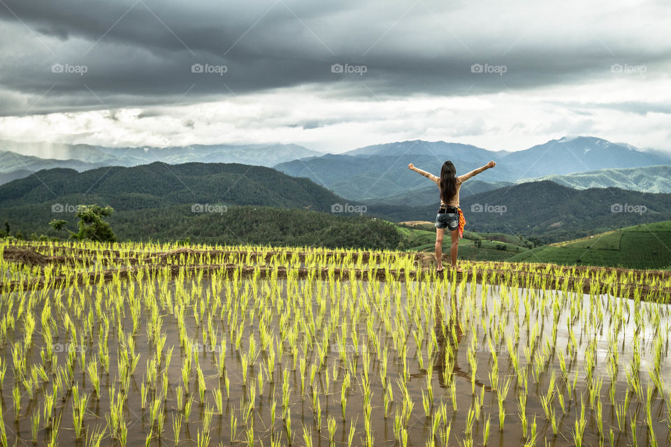 Breathing in a beautiful landscape with rice terraces and mountain.