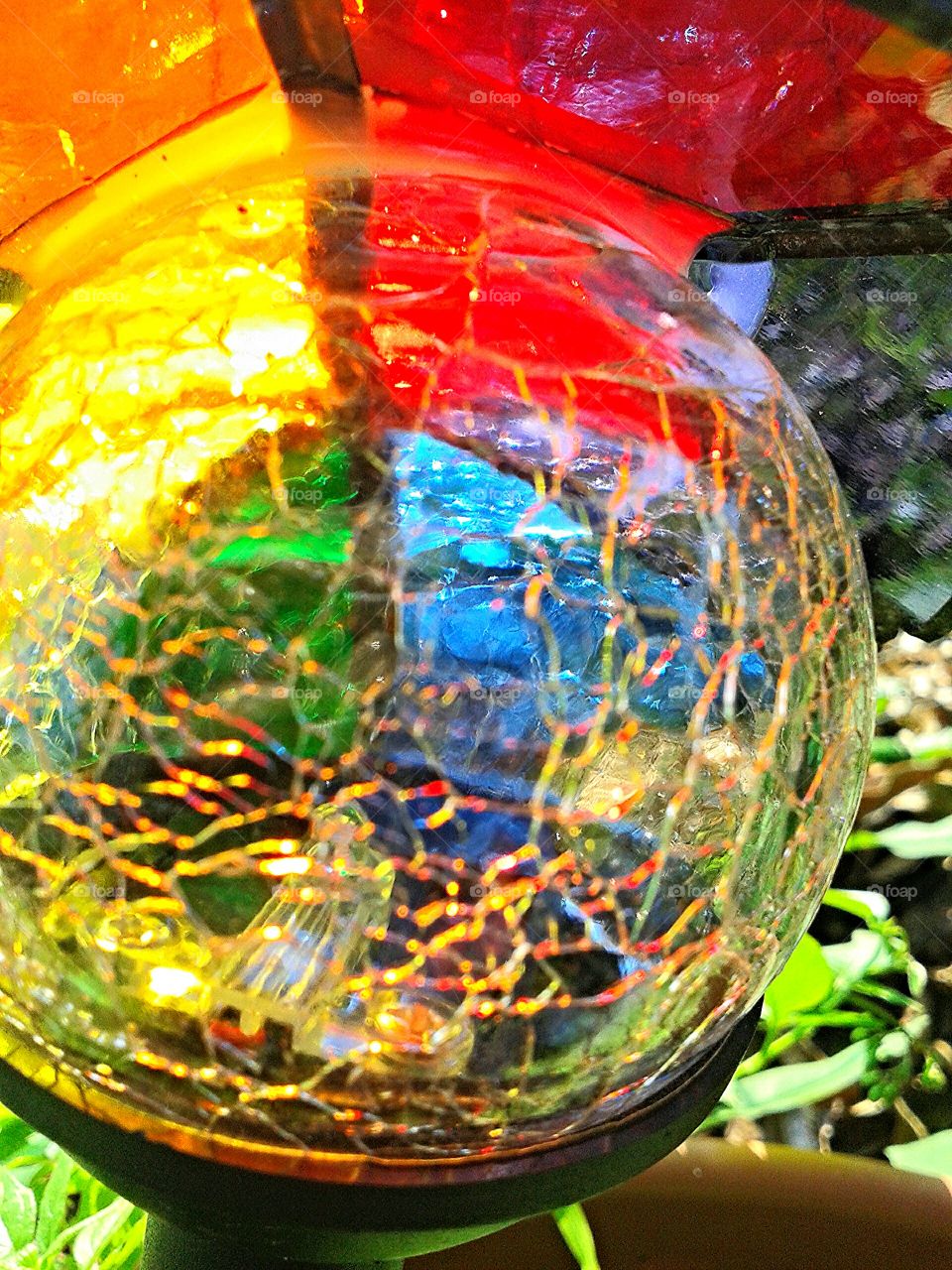Crackled glass garden orb. A special feature in my friend's garden.