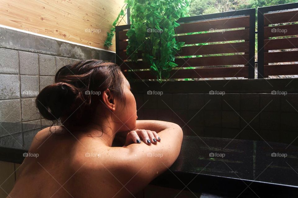 A woman enjoys a refreshing dip at a private hot spring resort near Taipei, Taiwan. 