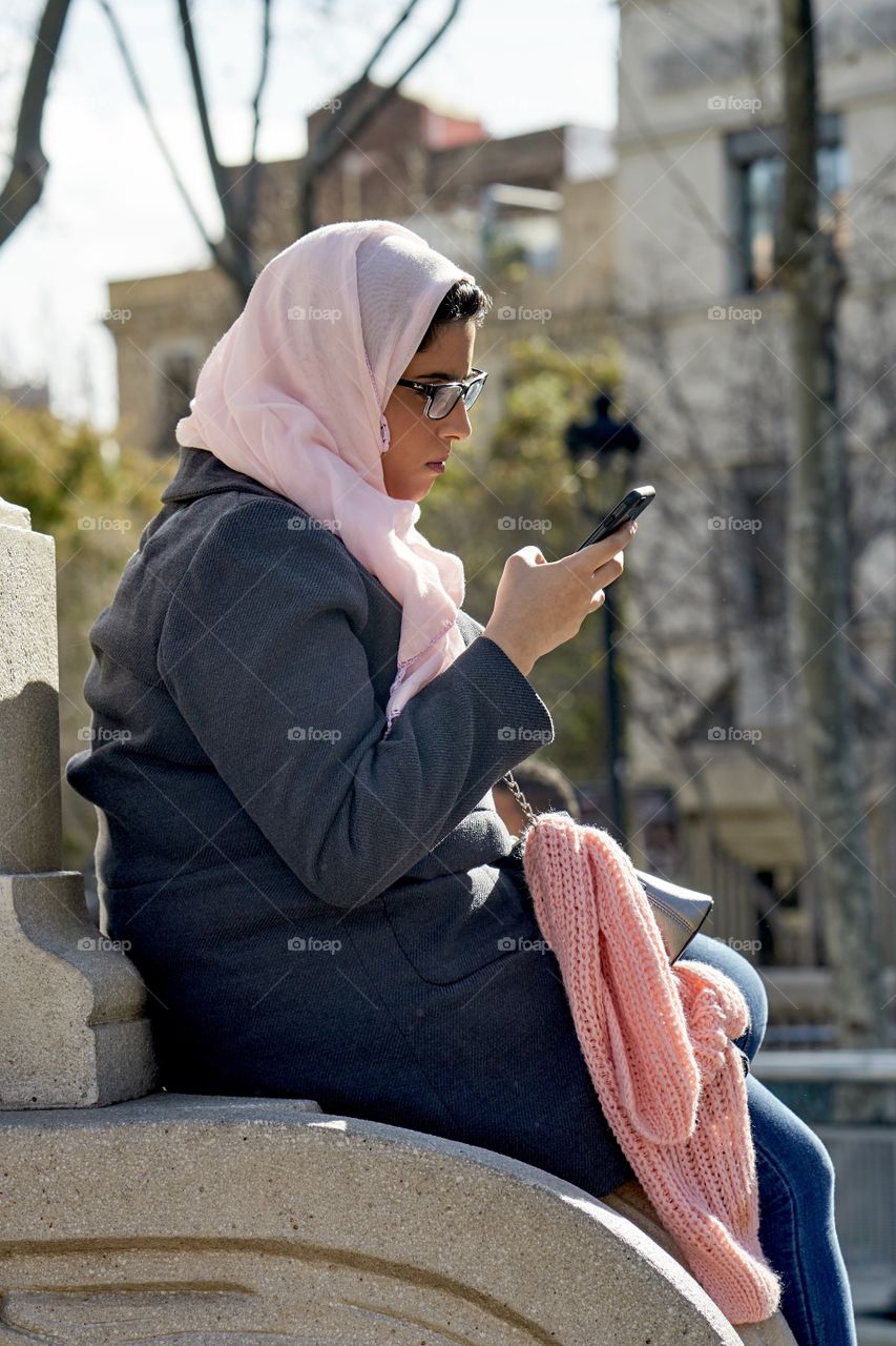 Muslim Woman with a mobile telephone 