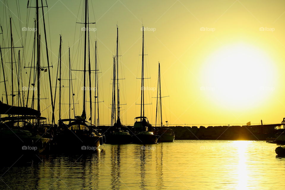 sailing boats moored in tel av. sailing boats moored at pier of tel aviv