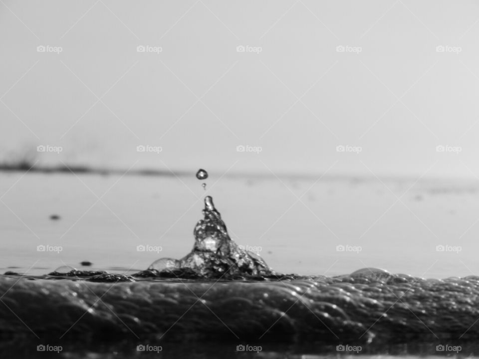Water bubbling up through the sand creating a beautiful abstract.