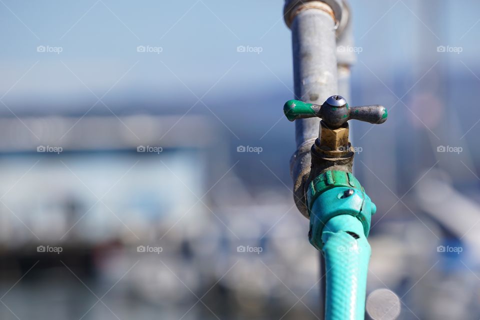 Close-up of hose attached to faucet