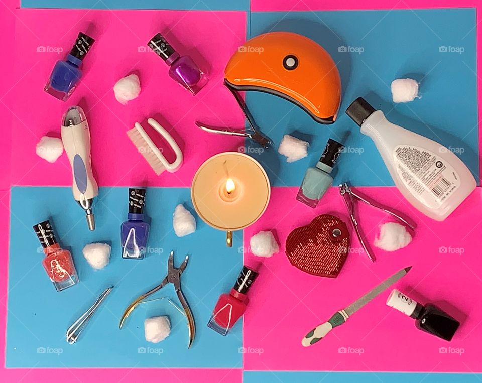 Makeup and cosmetic arranged in the flat lay position - A bird's eye view of a colorful array of carefully arranged fingernail polishes and paraphernalia to do nails.