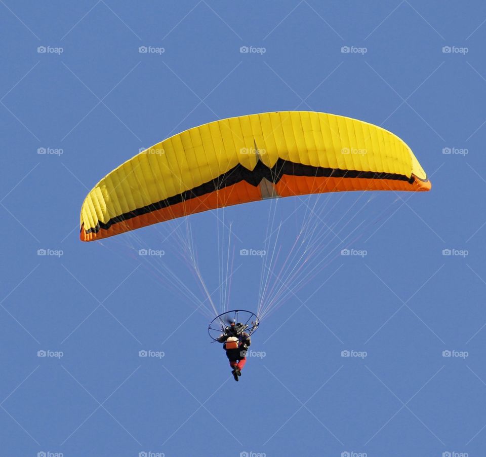 flying machine soaring in the blue skies above