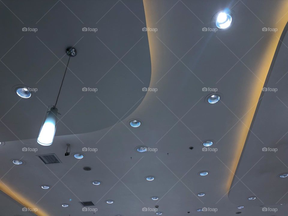 A lot of circle lamps in the ceiling
