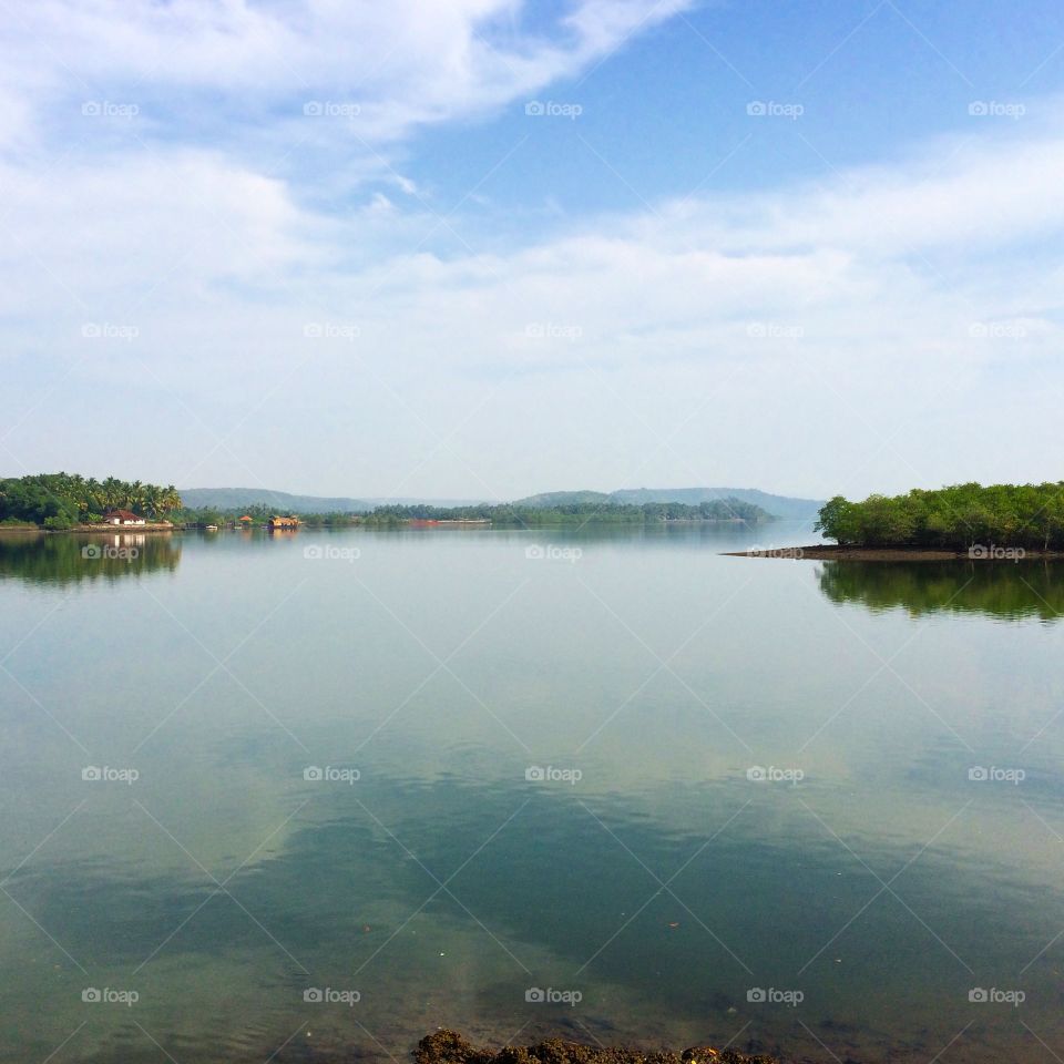 Morning reflection . River in Goa