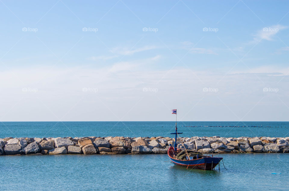 Fishing boat moored in the calm sea