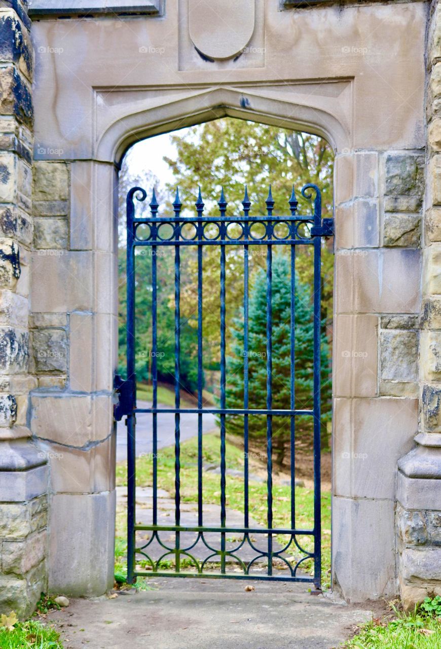 Metal gate at entry of cemetery 