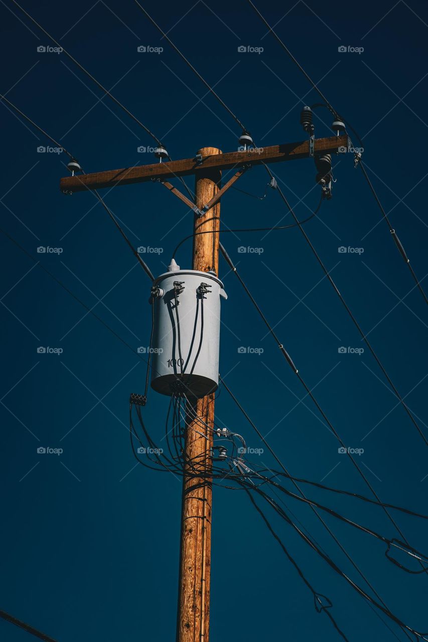 Telephone post with transformer.