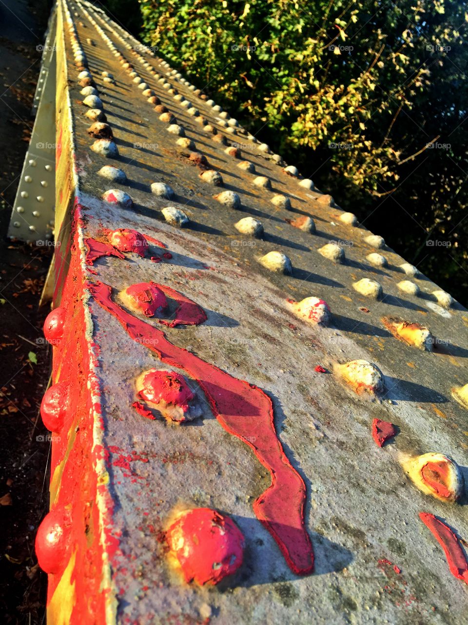 Red paint on old railway bridge