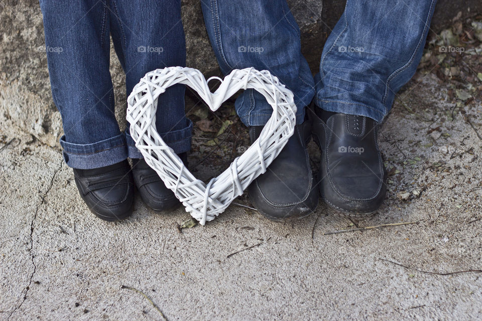 boy and girl with heart at their feet