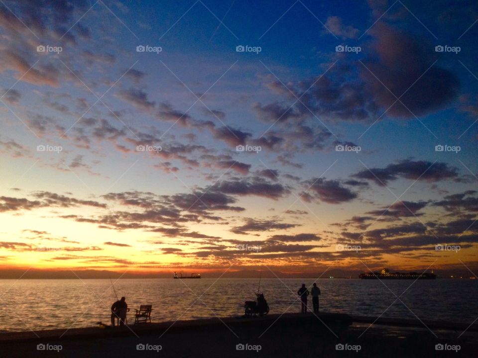 Fishermen silhouettes in thessaloniki.