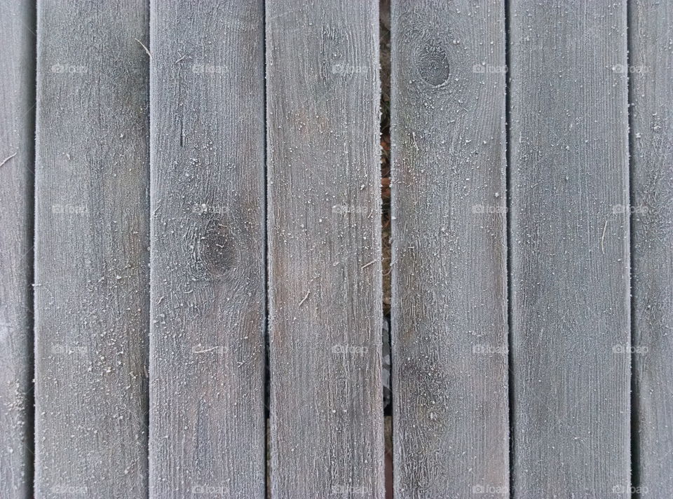 grey frozen table in the garden