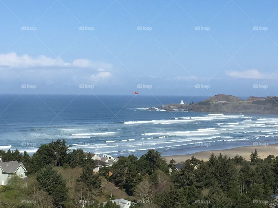 I am a tower technician, and get to see views far above where most other people dare to go.  This is Newport Oregon 

