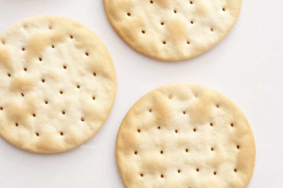 Three crackers on white background