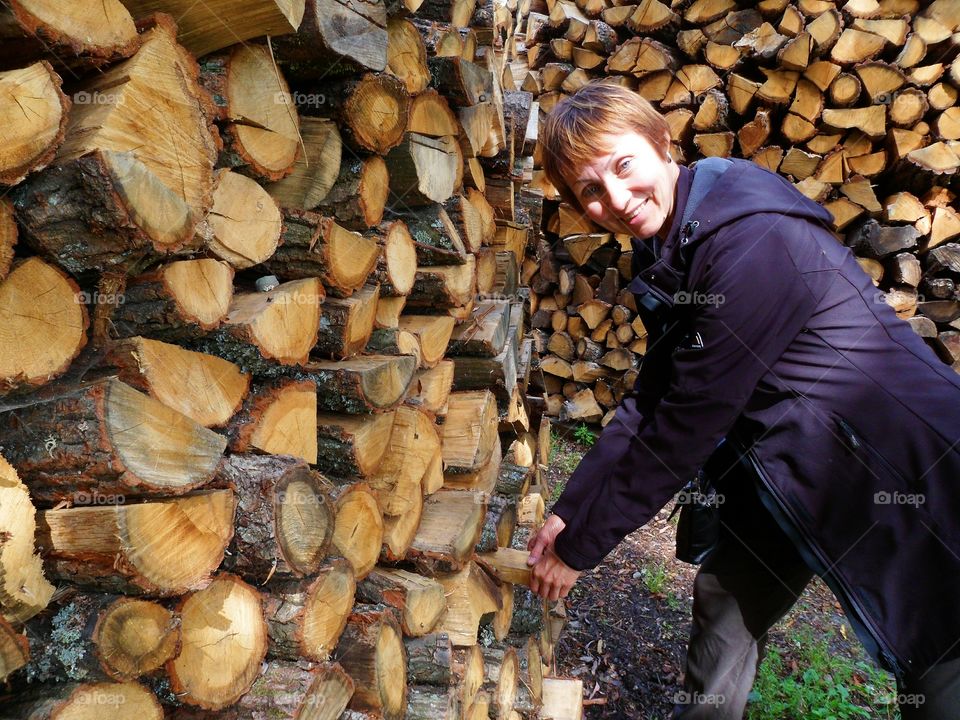 girl on the background of firewood