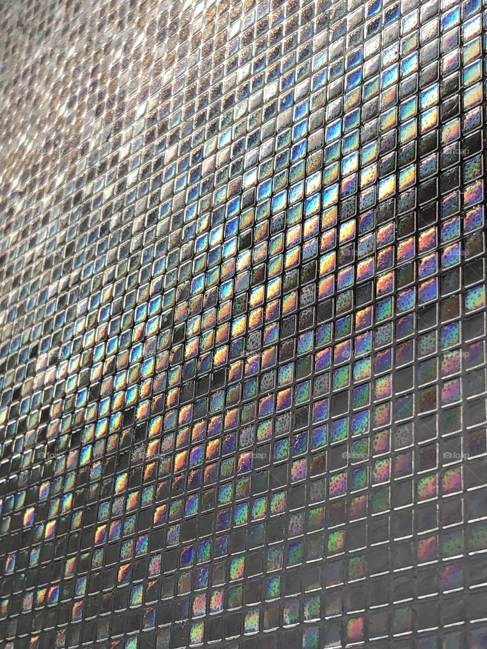 Rainbow colors reflected off glass 