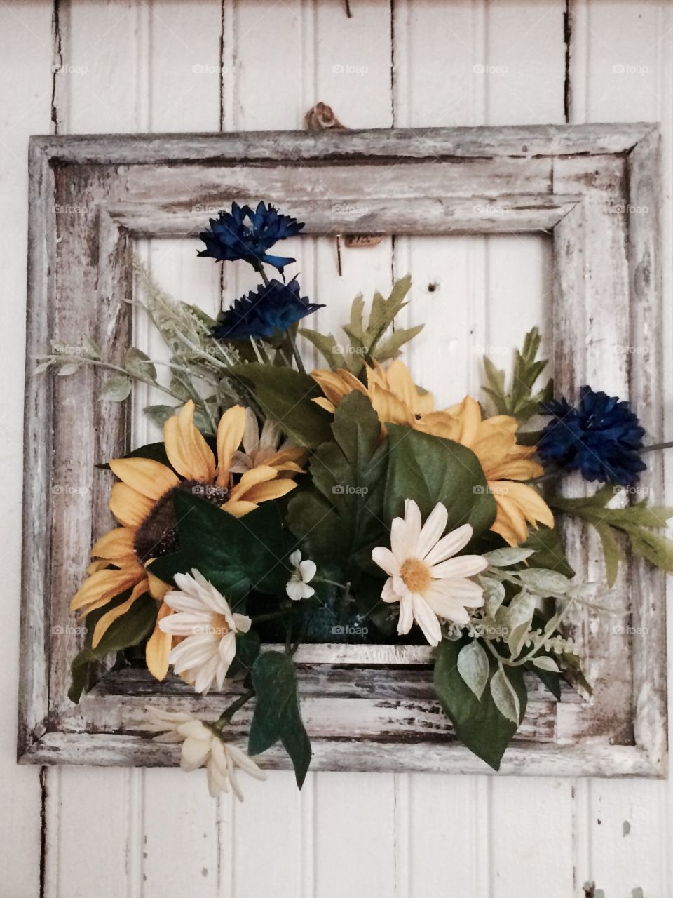 Antique flowers in distressed frame 