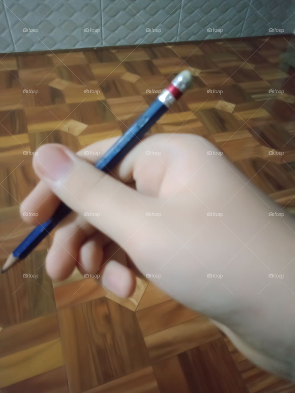 An artist hold his favourite pencil