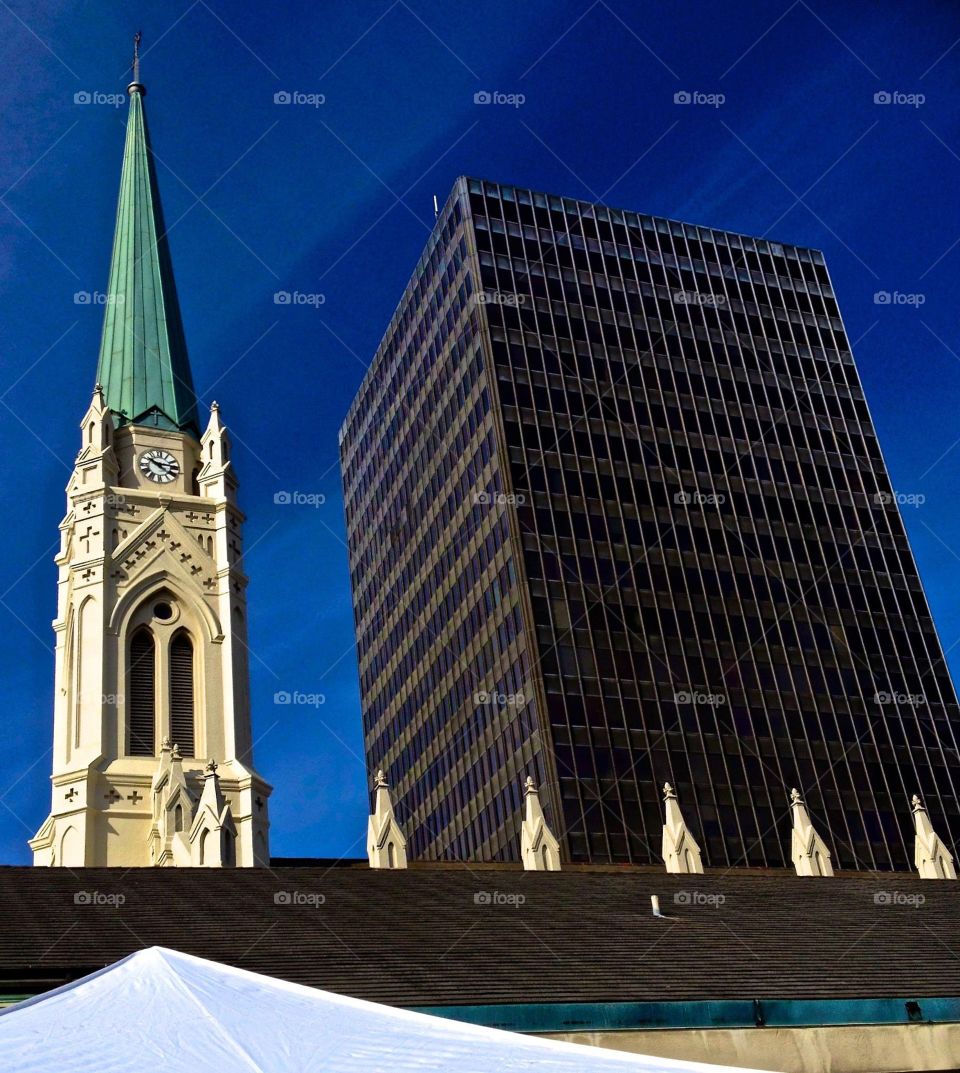 New & Old. Church steeple and modern building