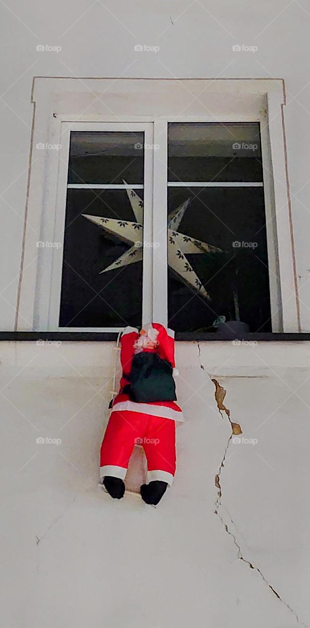 Santa crawling through the window