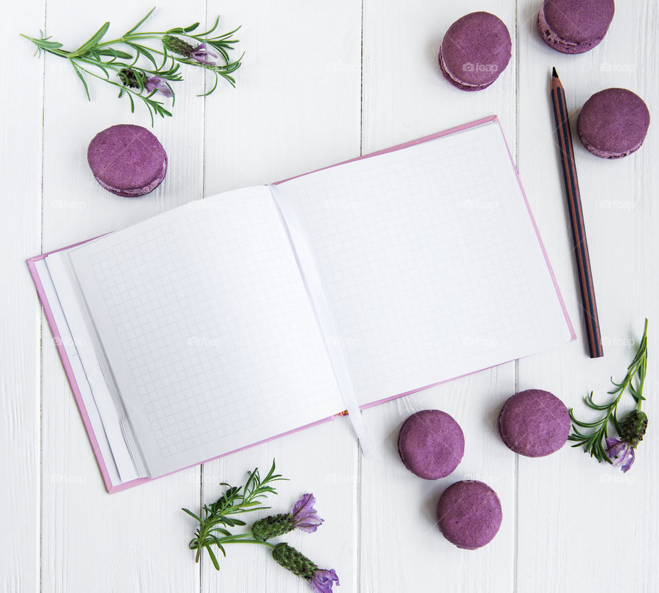 Notebook and french macaroons 