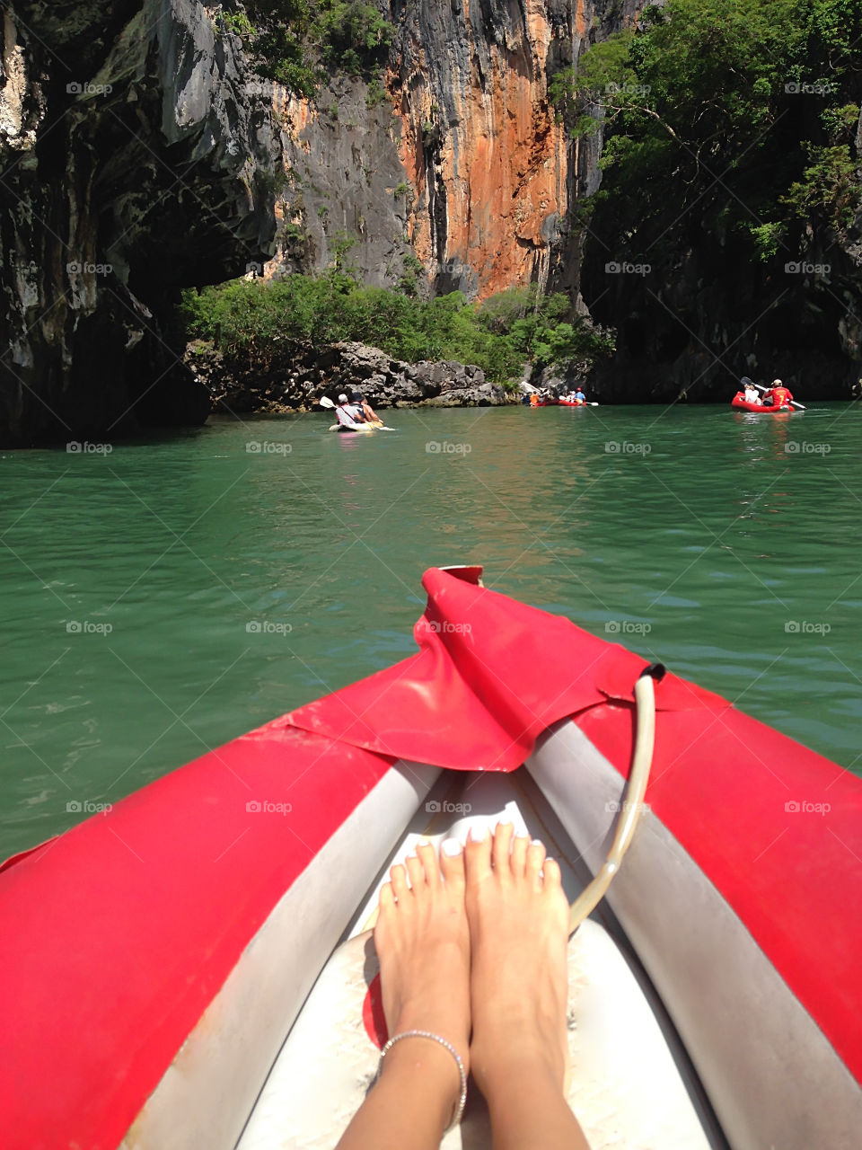 Swimming in boat to the rocks 