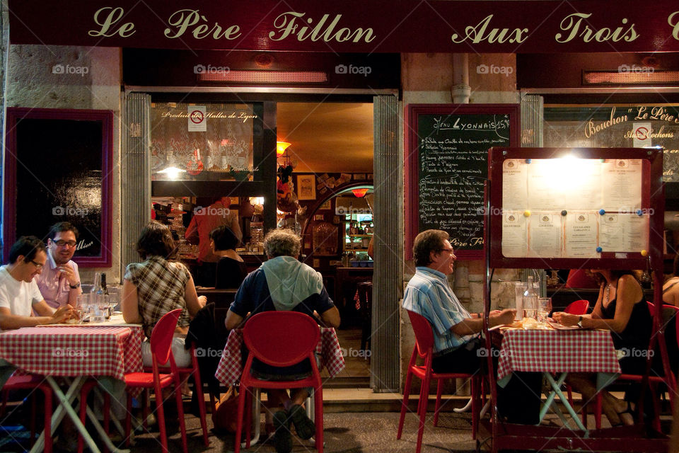 People eating at an outdoor café in Lyon France