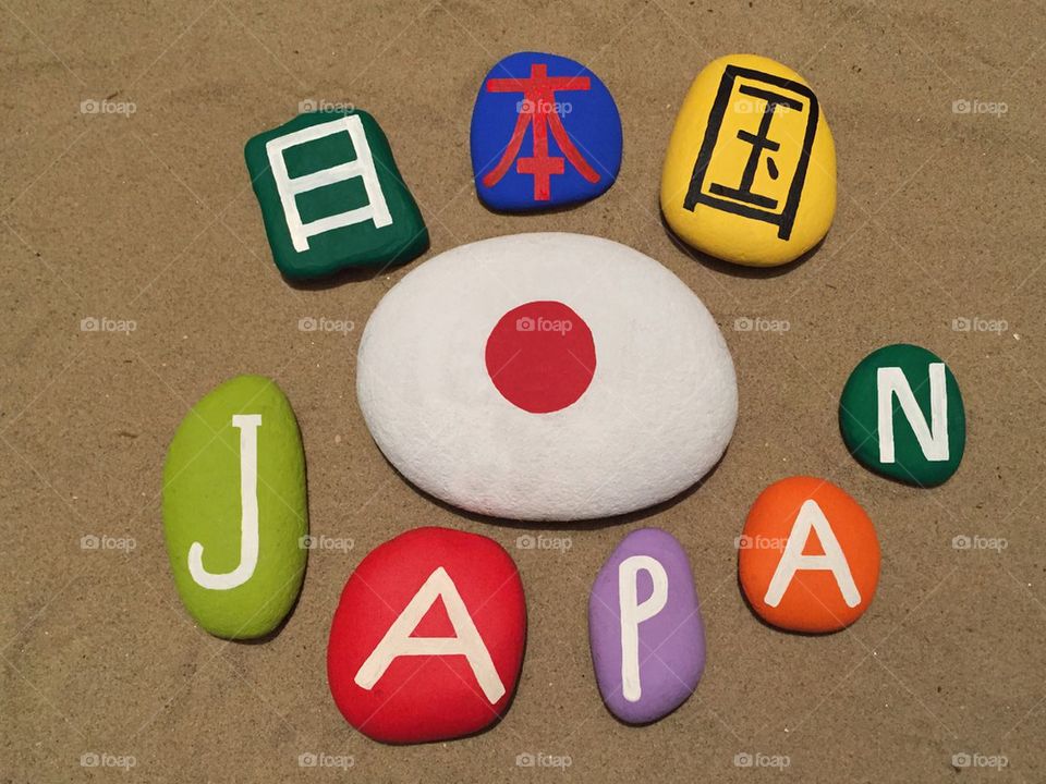 Japan with national flag on colored stones