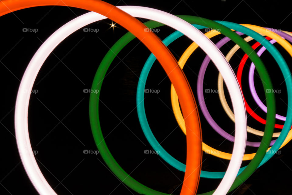 Multi coloured circles against black backgrounds